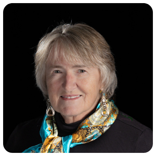 Ellie-Rock-smiling-wearing-brown-blue-black-scarf-and-black-turtle-neck-sweater1