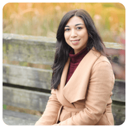 Fatima-Tima-Meshary-smiling-wearing-tan-jacket-and-brown-turtleneck-sweater1