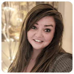 Breanne Lyng, Registered Psychotherapist, smiling in a professional headshot with long brown hair, photographed indoors with a softly blurred background.