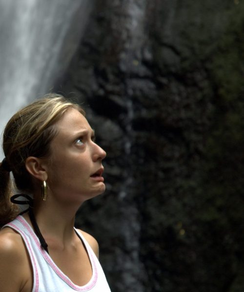 lady outside scared looking up