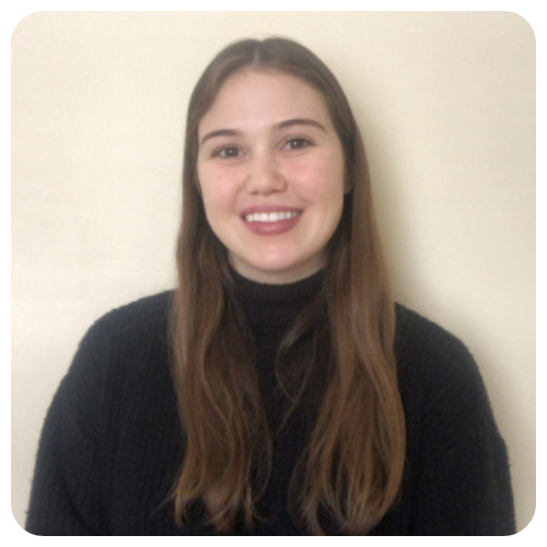 Rachel-Davies-smiling-wearing-dark-gray-sweater1