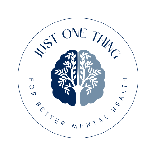 Circular logo reading “Just One Thing – For Better Mental Health,” featuring a stylized brain split into two blue tones with a tree growing through the center. Circular logo reading “Just One Thing – For Better Mental Health,” featuring a stylized brain split into two blue tones with a tree growing through the center.